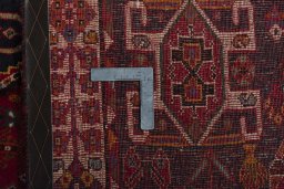 Surface texture of 2000s Shiraz rug with natural Wool and intricate pattern