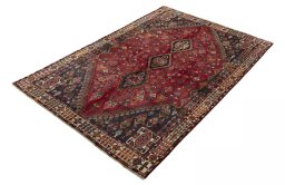 Corner detail of 2000s Shiraz rug showing border pattern and Wool pile