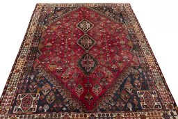 Surface texture of 2000s Shiraz rug with natural Wool and intricate pattern