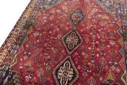 Backside of handmade 2000s Shiraz rug showing knot structure and weave density