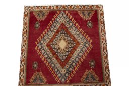 Surface texture of 2000s Shiraz rug with natural Wool and intricate pattern