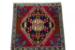 Surface texture of 2000s Shiraz rug with natural Wool and intricate pattern