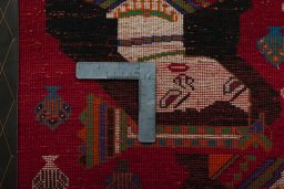 Backside of handmade 2000s Shiraz rug showing knot structure and weave density