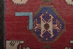 Backside of handmade 2000s Shiraz rug showing knot structure and weave density