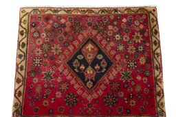 Surface texture of 2000s Shiraz rug with natural Wool and intricate pattern