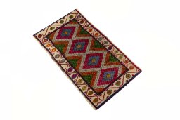 Corner detail of 2000s Shiraz rug showing border pattern and Wool pile