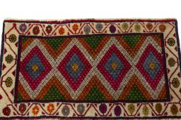 Surface texture of 2000s Shiraz rug with natural Wool and intricate pattern