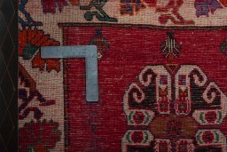 Backside of handmade 2000s Shiraz rug showing knot structure and weave density