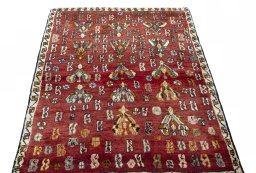 Surface texture of 2000s Shiraz rug with natural Wool and intricate pattern