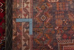 Backside of handmade 2000s Shiraz rug showing knot structure and weave density