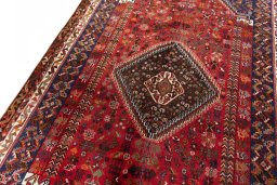 Backside of handmade 2000s Shiraz rug showing knot structure and weave density