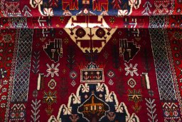 Corner detail of 2000s Shiraz rug showing border pattern and Wool pile