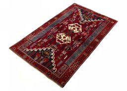 Corner detail of 2000s Shiraz rug showing border pattern and Wool pile
