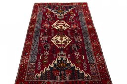 Surface texture of 2000s Shiraz rug with natural Wool and intricate pattern