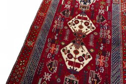 Backside of handmade 2000s Shiraz rug showing knot structure and weave density