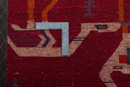 Backside of handmade 2000s Shiraz rug showing knot structure and weave density