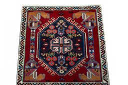 Surface texture of 2000s Shiraz rug with natural Wool and intricate pattern