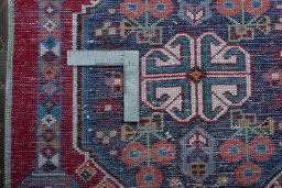 Backside of handmade 2000s Shiraz rug showing knot structure and weave density