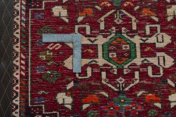 Backside of handmade 2000s Shiraz rug showing knot structure and weave density