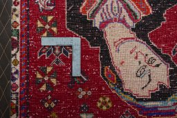 Backside of handmade 2000s Shiraz rug showing knot structure and weave density