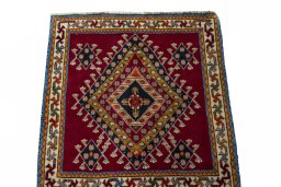 Surface texture of 2000s Shiraz rug with natural Wool and intricate pattern
