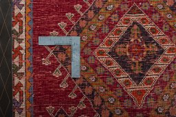 Backside of handmade 2000s Shiraz rug showing knot structure and weave density