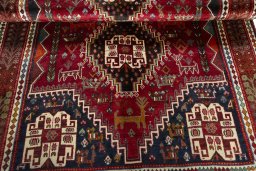 Corner detail of 2000s Shiraz rug showing border pattern and Wool pile
