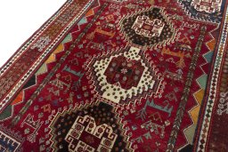 Backside of handmade 2000s Shiraz rug showing knot structure and weave density