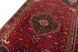 Backside of handmade 2000s Shiraz rug showing knot structure and weave density