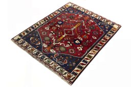 Corner detail of 2000s Shiraz rug showing border pattern and Wool pile