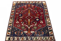 Surface texture of 2000s Shiraz rug with natural Wool and intricate pattern