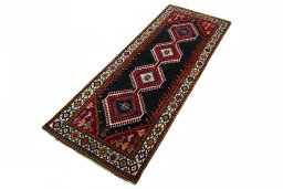 Corner detail of 2000s Shiraz rug showing border pattern and Wool pile