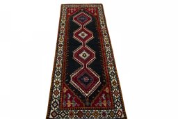 Surface texture of 2000s Shiraz rug with natural Wool and intricate pattern