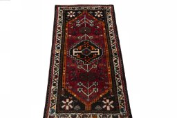 Surface texture of 2000s Shiraz rug with natural Wool and intricate pattern