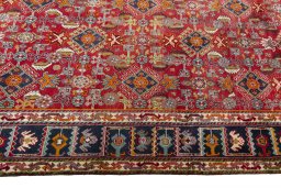 Corner detail of 2000s Shiraz rug showing border pattern and Wool pile