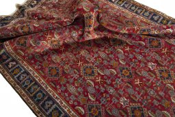 Surface texture of 2000s Shiraz rug with natural Wool and intricate pattern