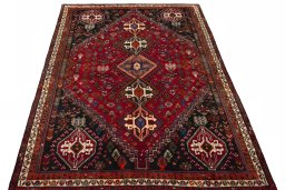 Surface texture of 2000s Shiraz rug with natural Wool and intricate pattern