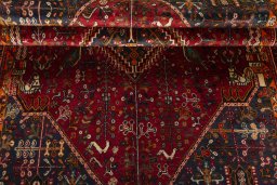 Corner detail of 2000s Shiraz rug showing border pattern and Wool pile