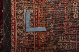 Surface texture of 2000s Shiraz rug with natural Wool and intricate pattern