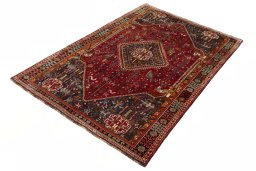 Corner detail of 2000s Shiraz rug showing border pattern and Wool pile