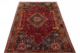 Surface texture of 2000s Shiraz rug with natural Wool and intricate pattern