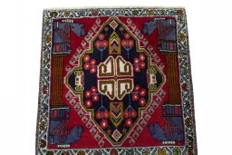Surface texture of 2000s Shiraz rug with natural Wool and intricate pattern