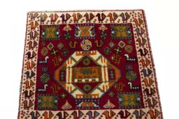 Surface texture of 2000s Shiraz rug with natural Wool and intricate pattern