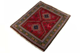 Corner detail of 2000s Shiraz rug showing border pattern and Wool pile