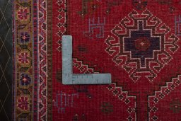 Backside of handmade 2000s Shiraz rug showing knot structure and weave density