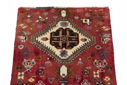 Surface texture of 2000s Shiraz rug with natural Wool and intricate pattern