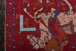 Backside of handmade 2000s Shiraz rug showing knot structure and weave density