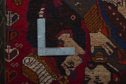 Backside of handmade 2000s Shiraz rug showing knot structure and weave density
