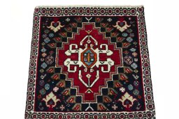 Surface texture of 2000s Shiraz rug with natural Wool and intricate pattern