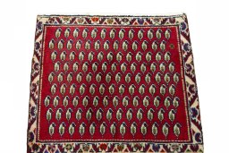 Surface texture of 2000s Shiraz rug with natural Wool and intricate pattern